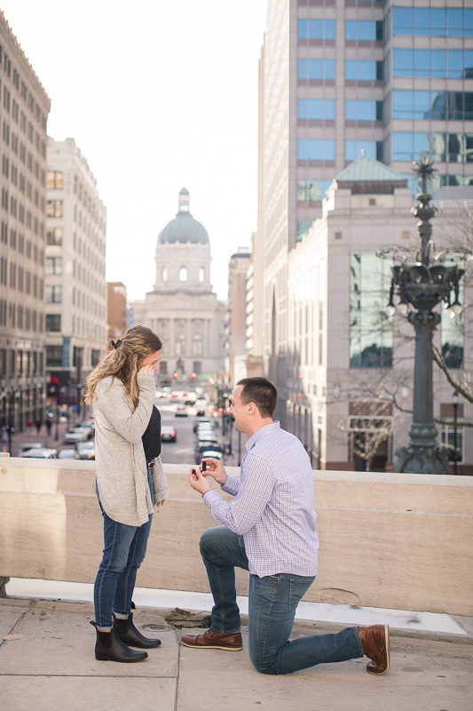 A proposal downtown Indianapolis on the circle at sunset.